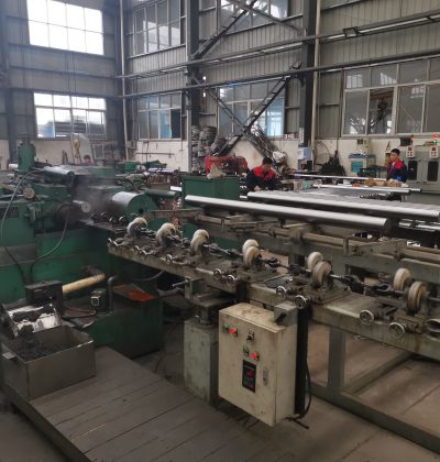 Piston rod centerless grinder